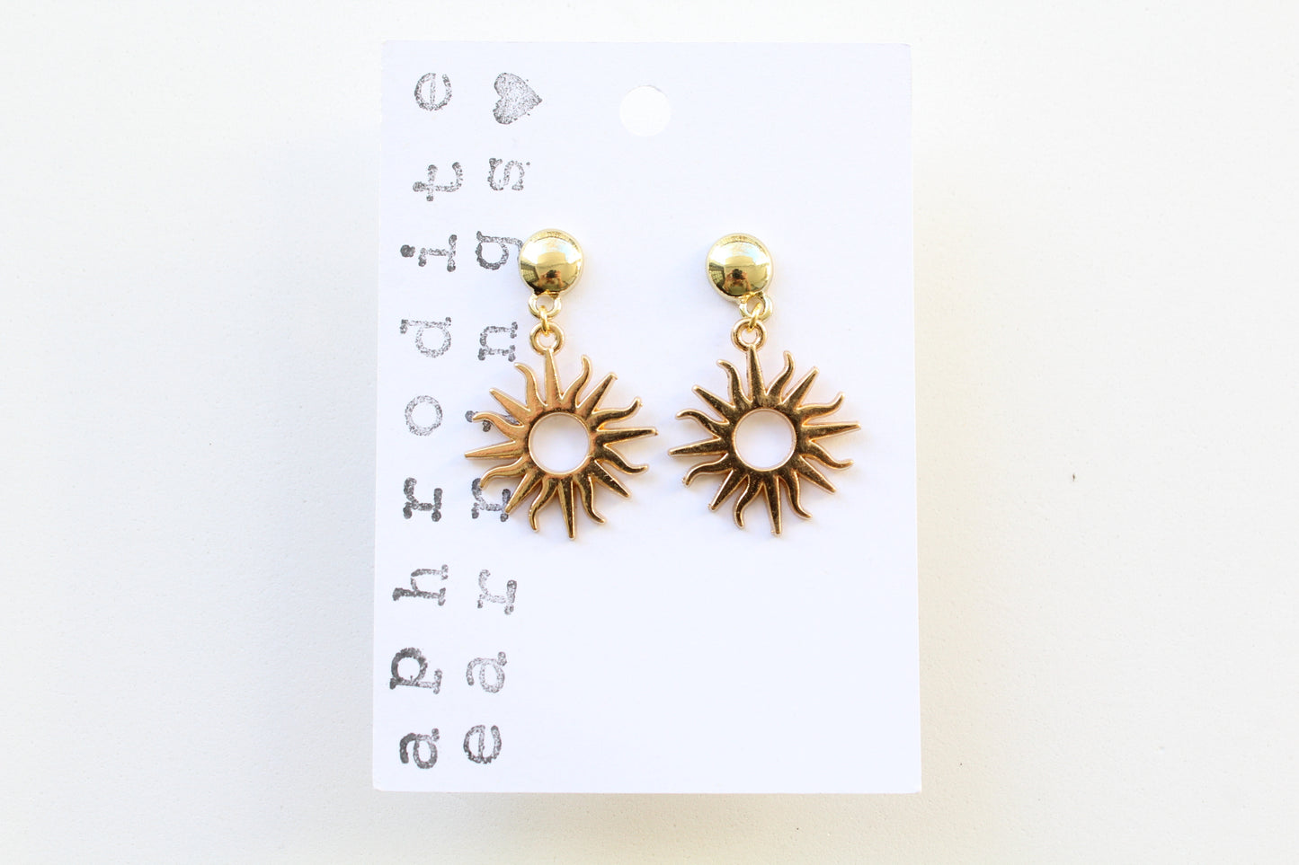 gold sun charm earrings