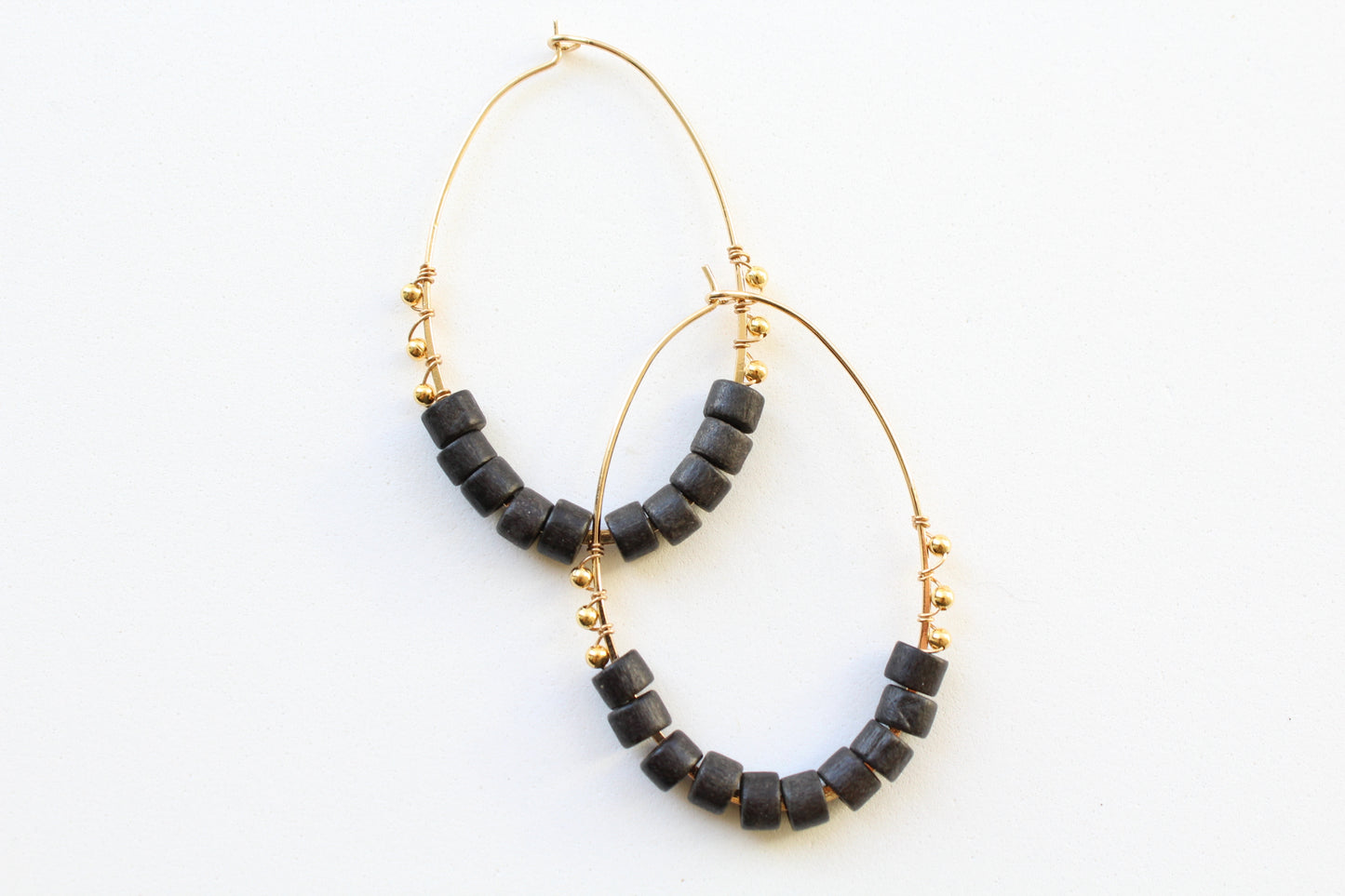 gold hoops with black beaded detail